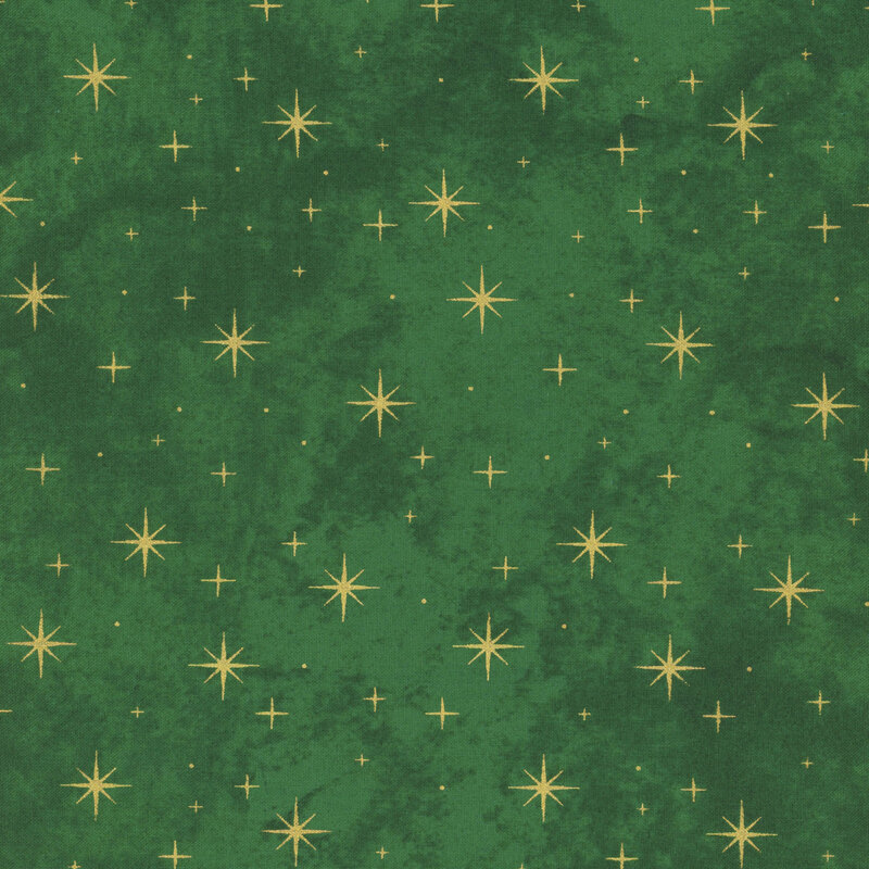 mottled evergreen fabric featuring gold metallic stars