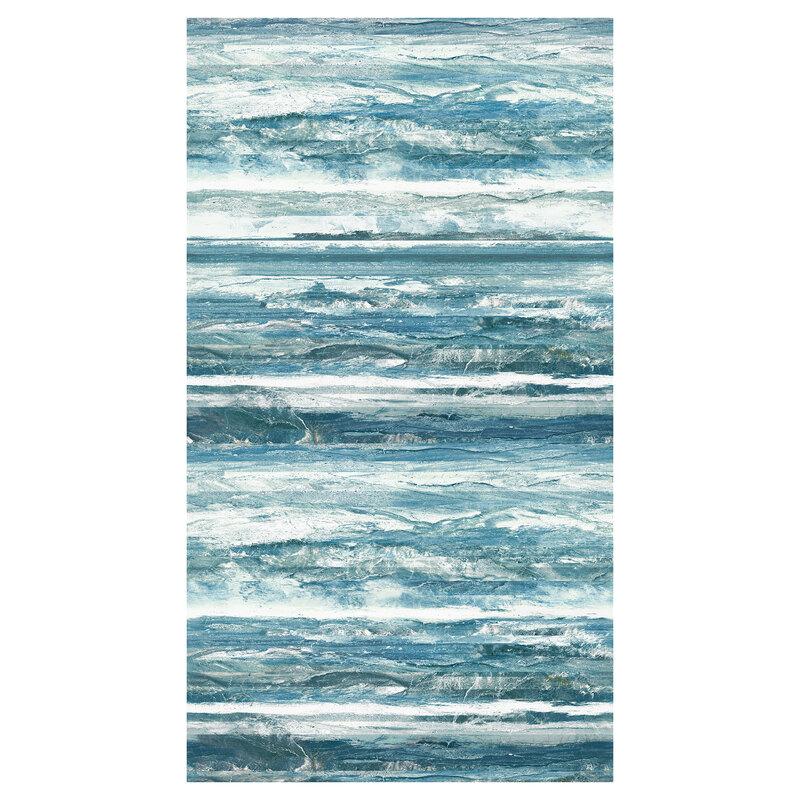 Fabric with a rough textured print in shades of deep teal, ice blue, and white which resembles waves and rugged coastline
