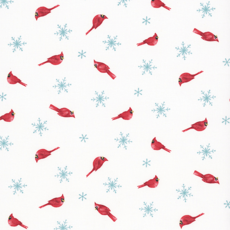 bright red cardinals and icy blue snowflakes tossed on a bright white background