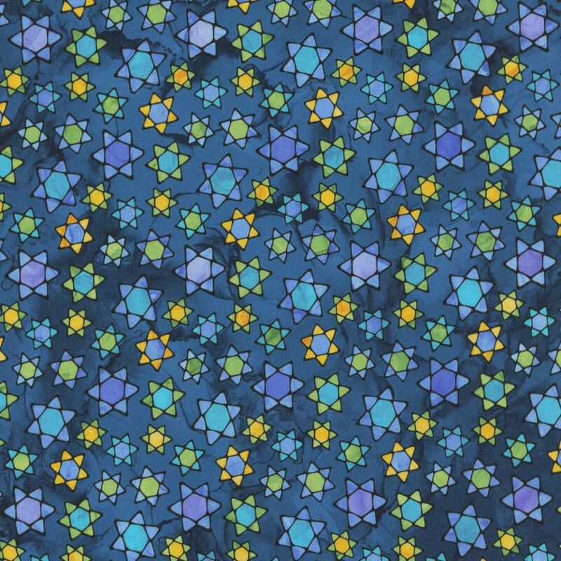 A blue Hanukkah themed fabric featuring tossed Stars of David with a stained glass design. 