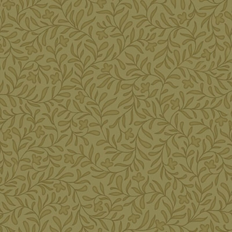 An army green fabric with a dense tonal leafy vine design