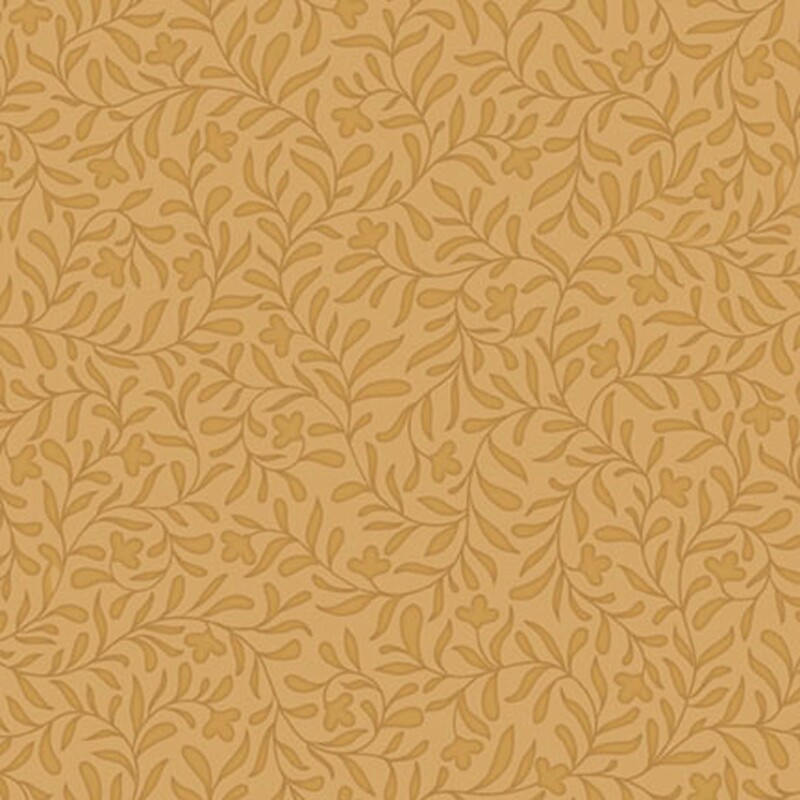 A golden ocher fabric with a dense tonal leafy vine design