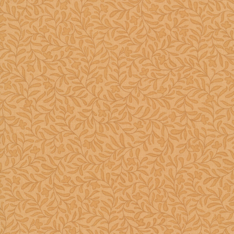 A golden ocher fabric with a dense tonal leafy vine design