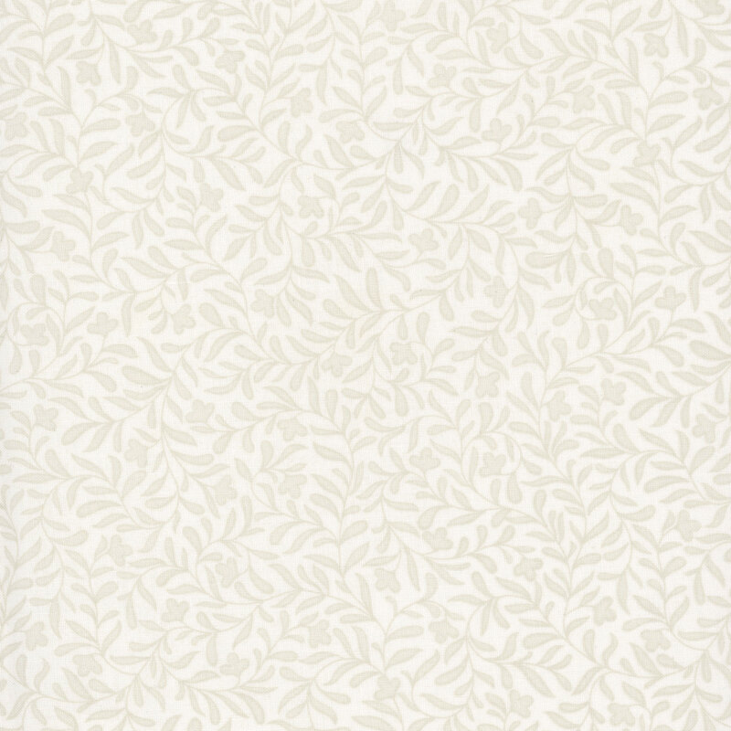 A light cream fabric with a dense tonal leafy vine design