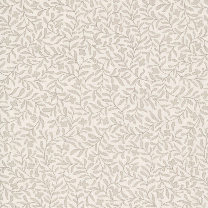 An eggshell fabric with a dense beige leafy vine design