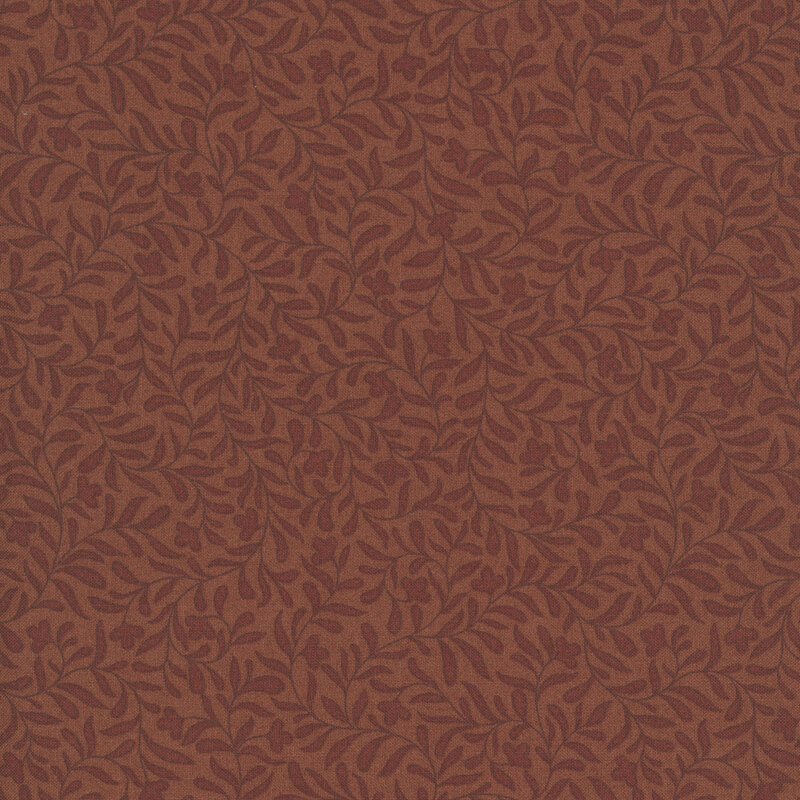 A cinnamon brown fabric with a dense tonal leafy vine design