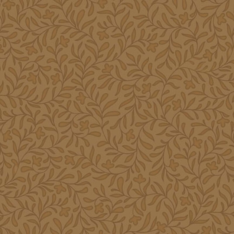 A maple colored fabric with a dense brown leafy vine design.