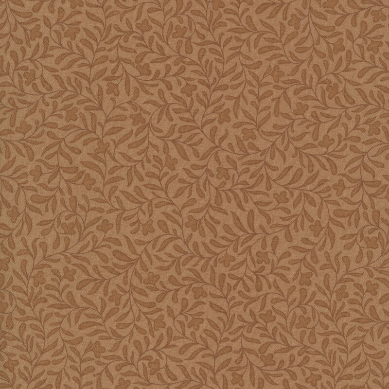A maple colored fabric with a dense brown leafy vine design.