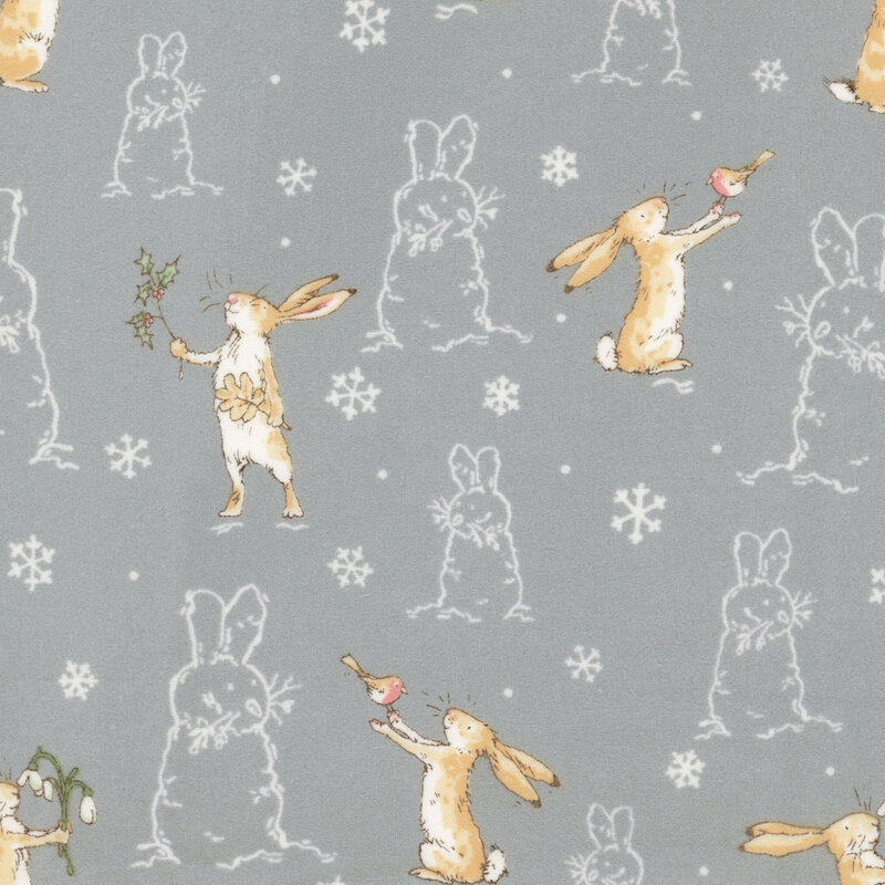 Slate gray fabric with a pattern of the Little Nutbrown Hare and white outlines of bunny-snowmen and snowflakes.