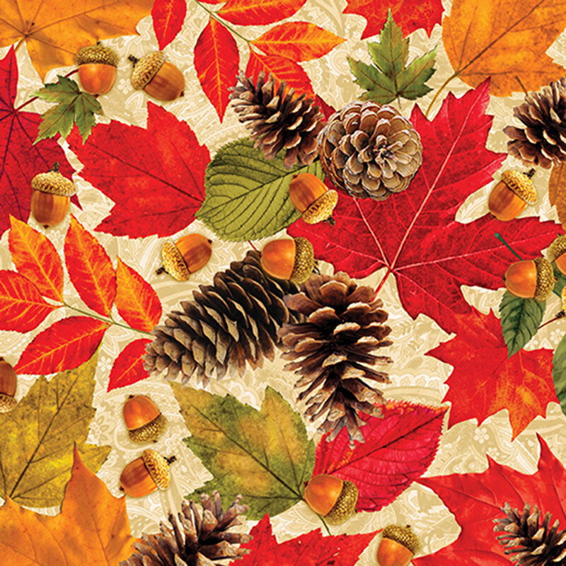 Orange, green, and red fall leaves scattered with acorns and pine cones on a cream paisley background.