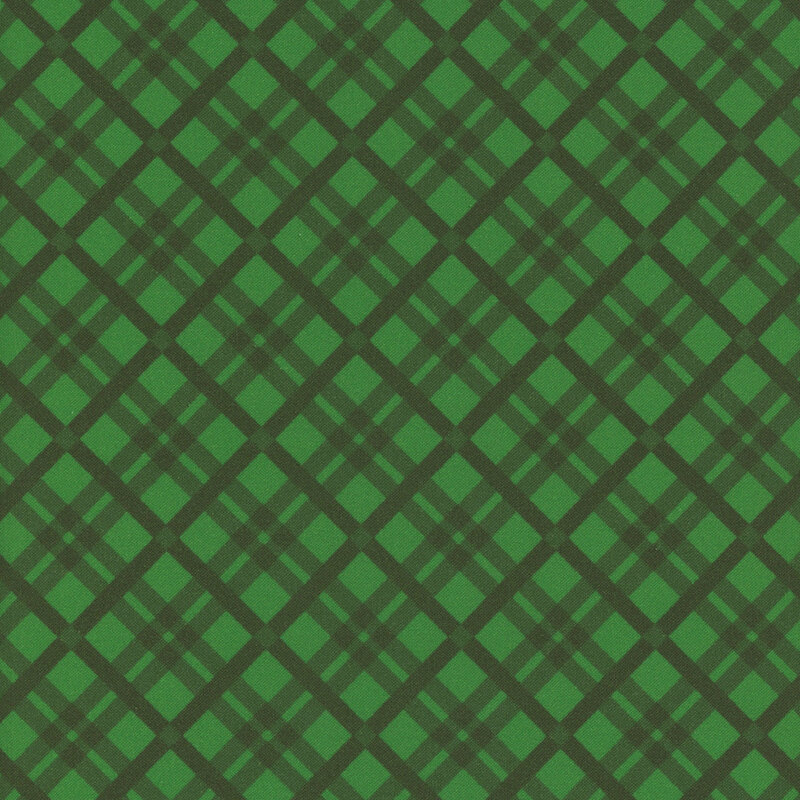 An emerald green fabric with a dark green tartan pattern