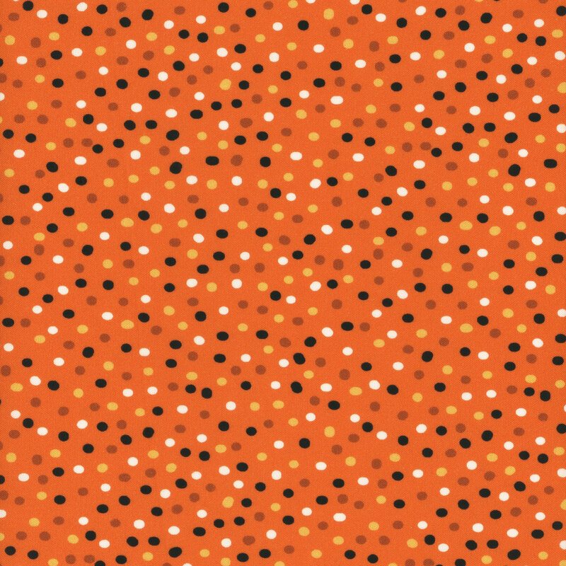 pumpkin orange fabric with multicolor polka dots.