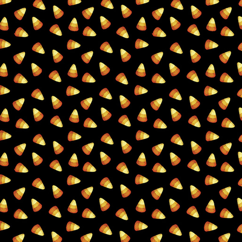 ditzy yellow, tangerine, and dark orange candy corn on a black background.