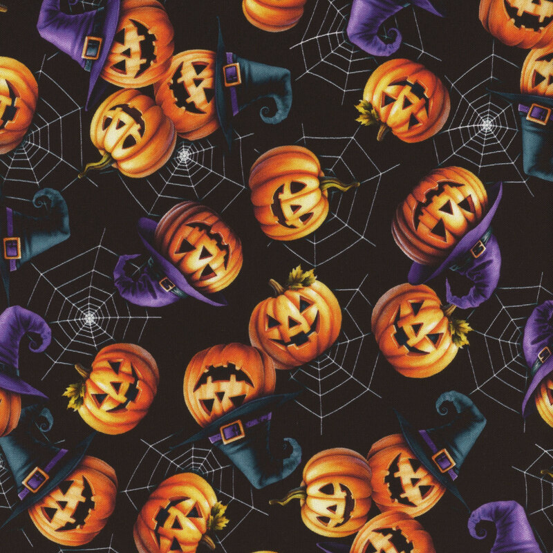 black fabric featuring smiling jack o' lanterns wearing wizard hats on a background of white spider webs.
