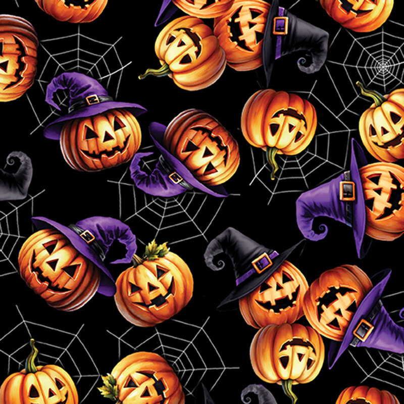 black fabric featuring smiling jack o' lanterns wearing wizard hats on a background of white spider webs.