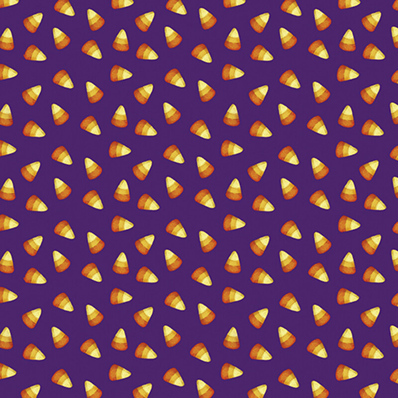 ditzy yellow, tangerine, and dark orange candy corn on a purple background.