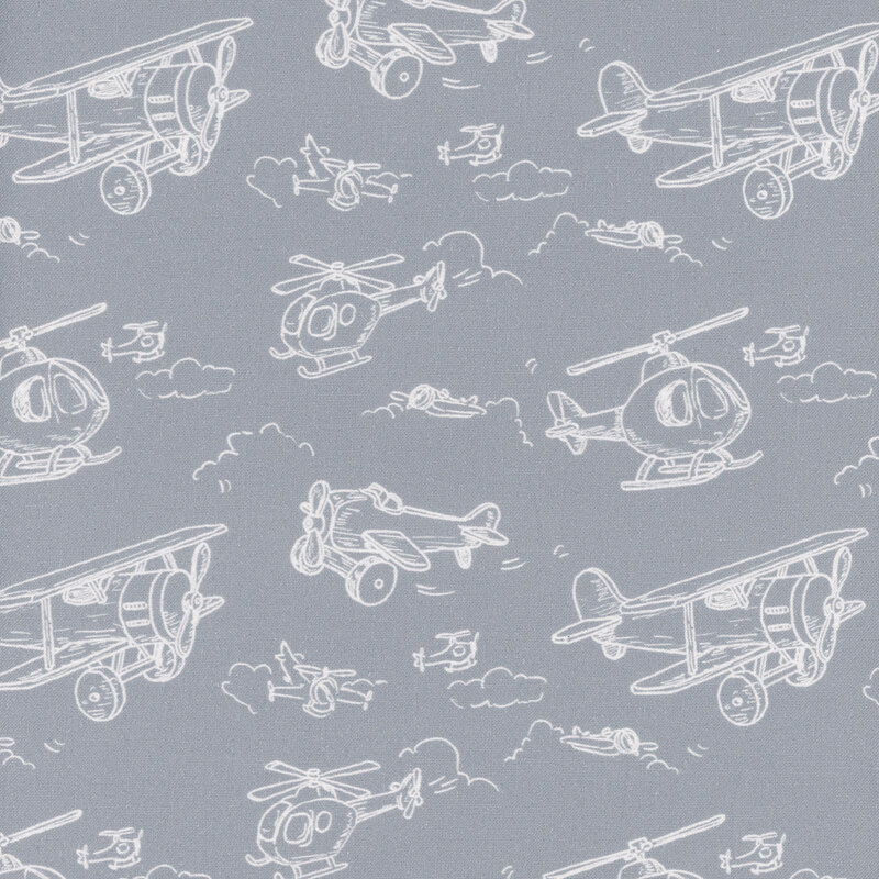 airplanes and helicopters in cream outlines on blue gray fabric.