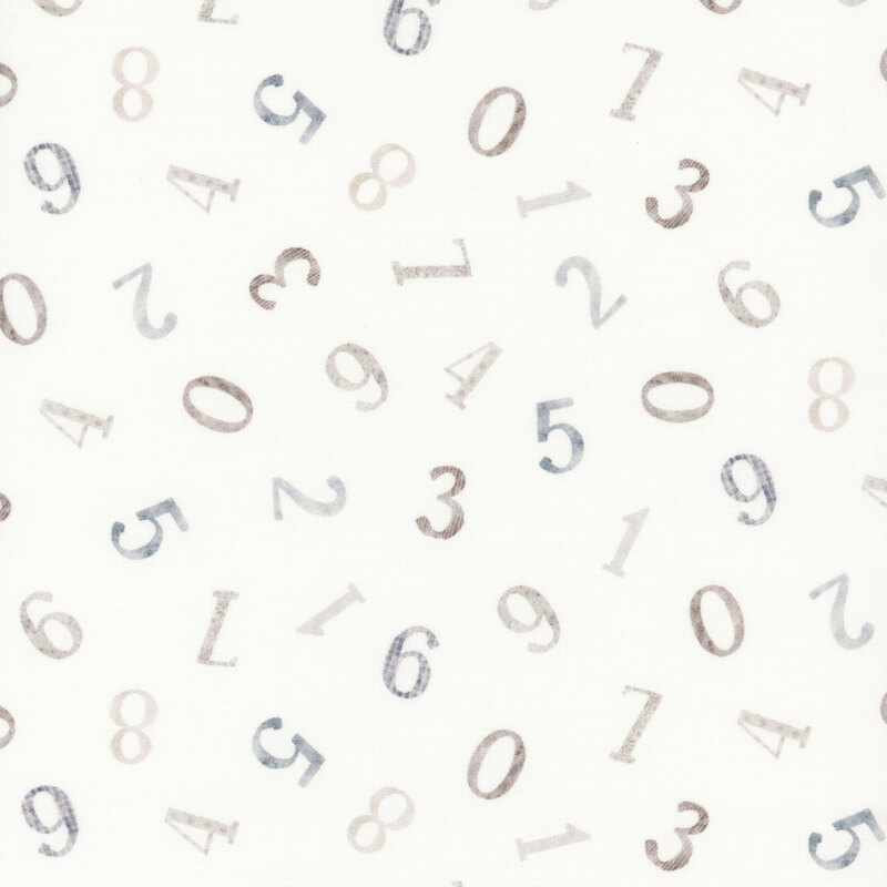 numbers in different muted shades of browns and blues tossed on white fabric