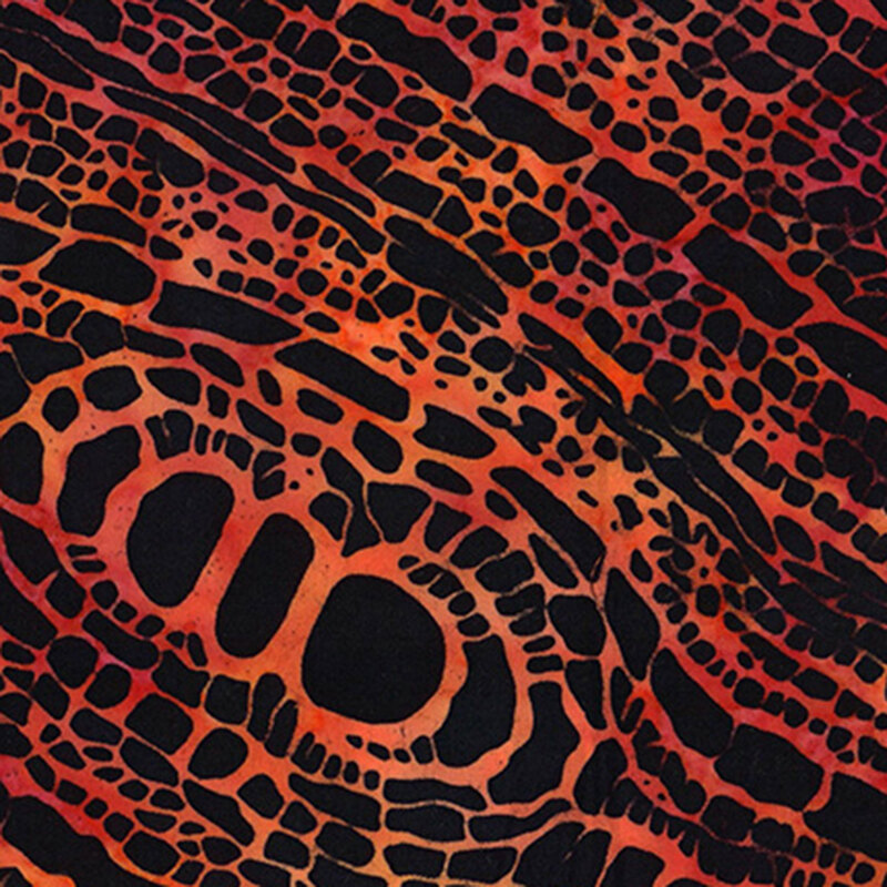 mottled red orange pattern of burning wood texture on a black background.