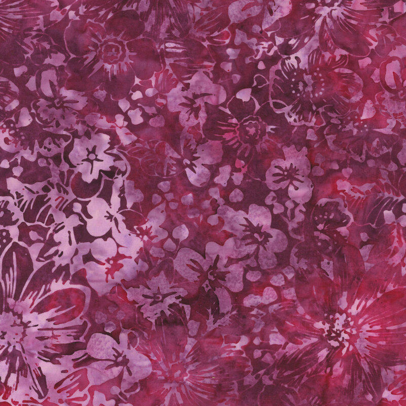 Magenta watercolor fabric with splotches of red a tonal floral overlay
