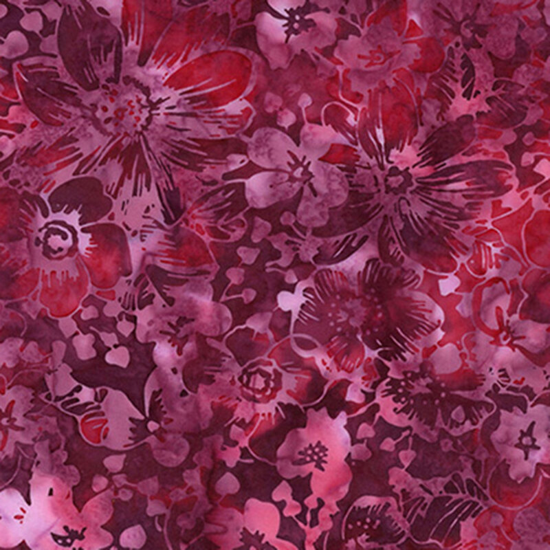 Magenta watercolor fabric with splotches of red a tonal floral overlay
