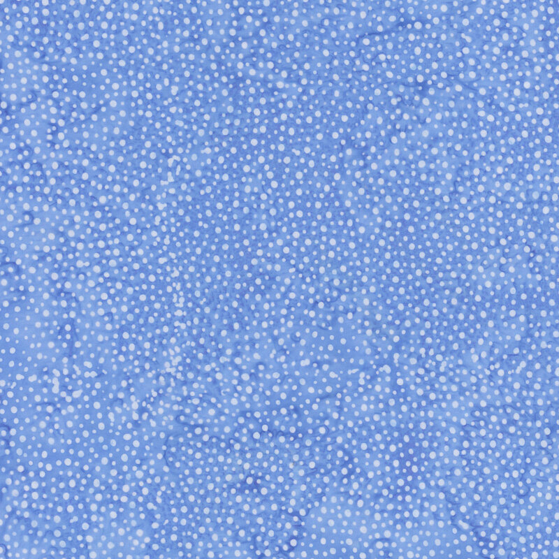 A tonal mottled blue fabric with lighter blue dots. 