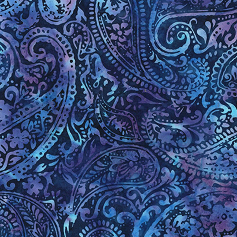 A mottled blue fabric with a lighter blue decorated paisley design.  