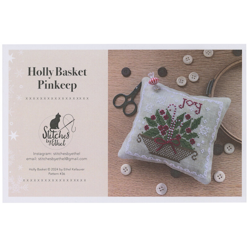 The front of the Holly Basket Pinkeep showing the completed pinkeep.