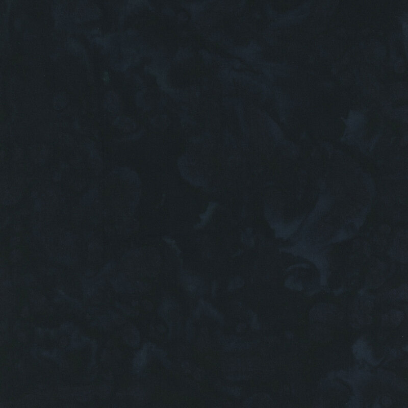 Batik fabric with black mottling.