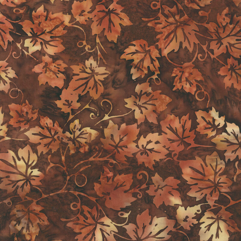 mottled cream, burnt sienna, and dark gray oak leaves and vines on a mottled dark brown batik fabric