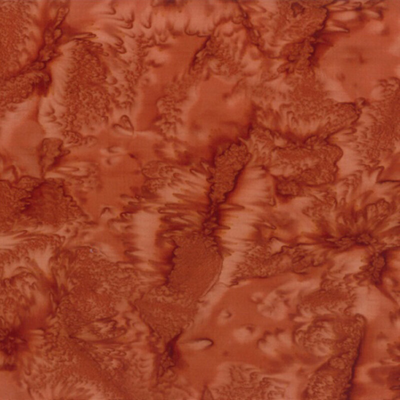 Sienna orange fabric with a tonal watercolor pattern.