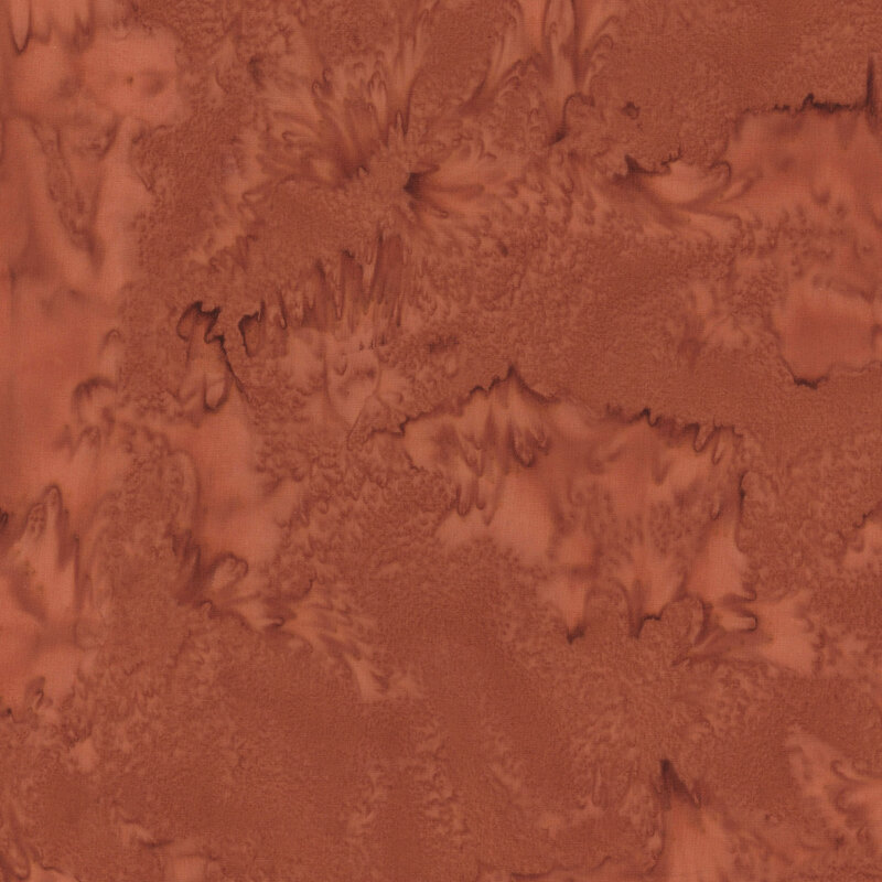 Sienna orange fabric with a tonal watercolor pattern.