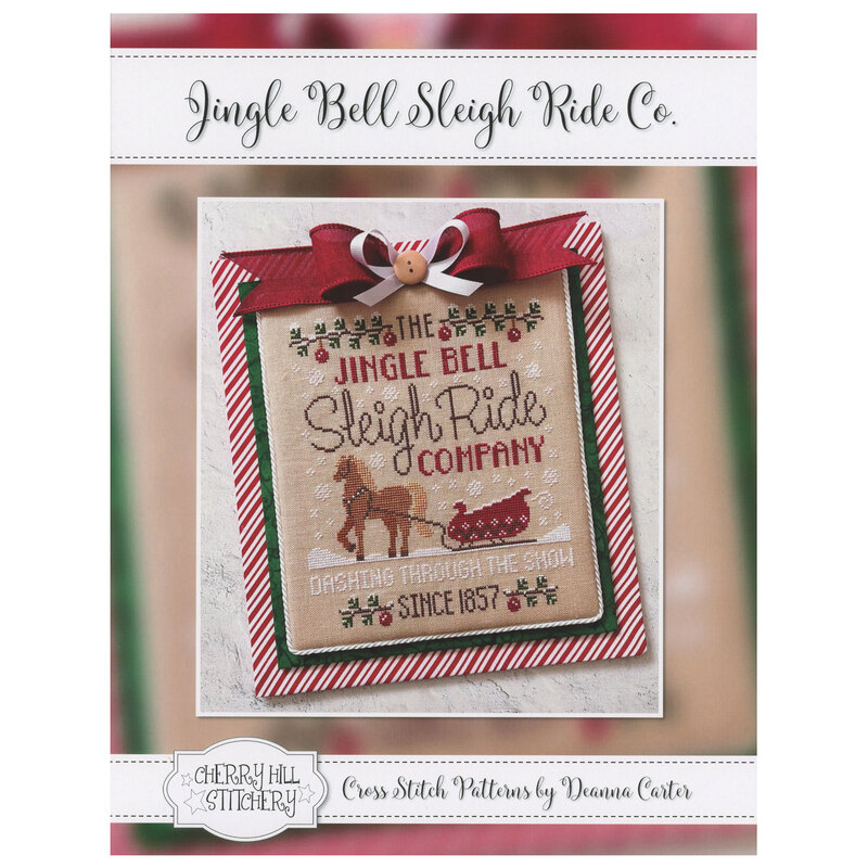 The front of the Jingle Bell Sleigh Ride Co. pattern showing a picture of the completed project framed with a bow.