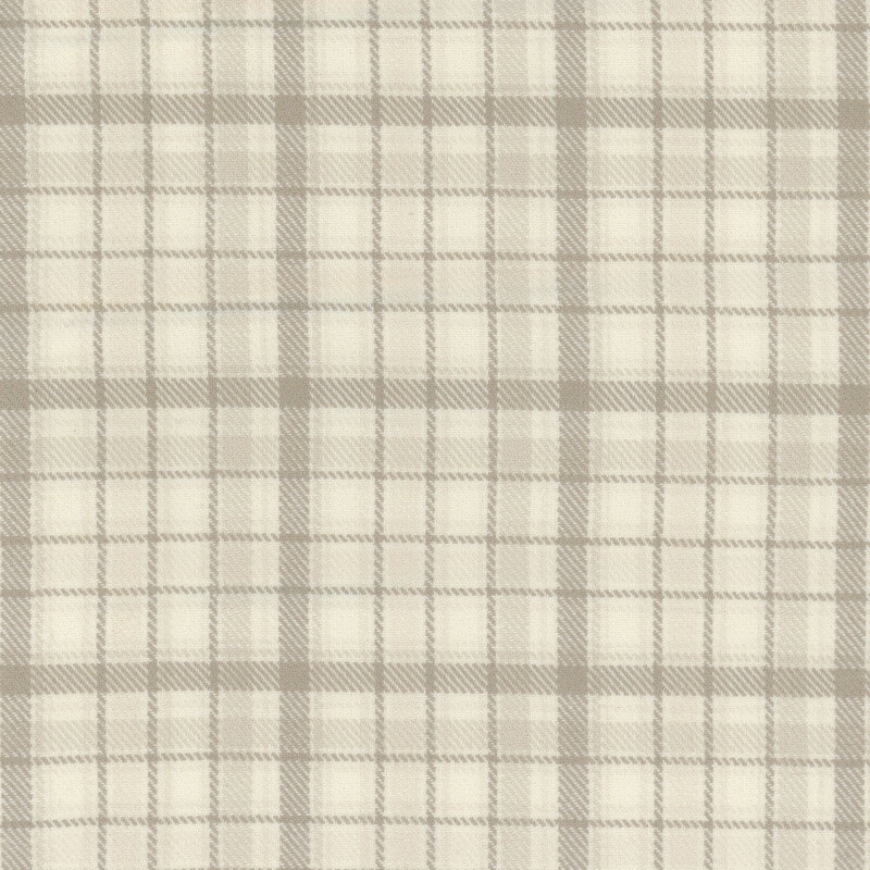 Flannel with a cream and brown neutral plaid pattern.