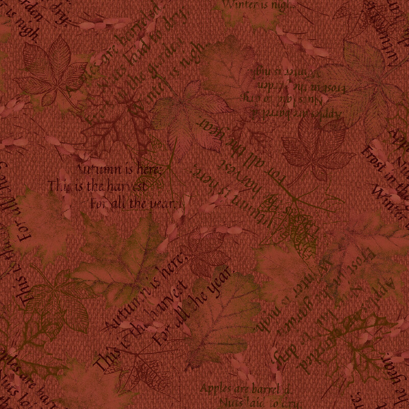 An auburn red woven textured fabric with printed leaves and autumn-themed text 