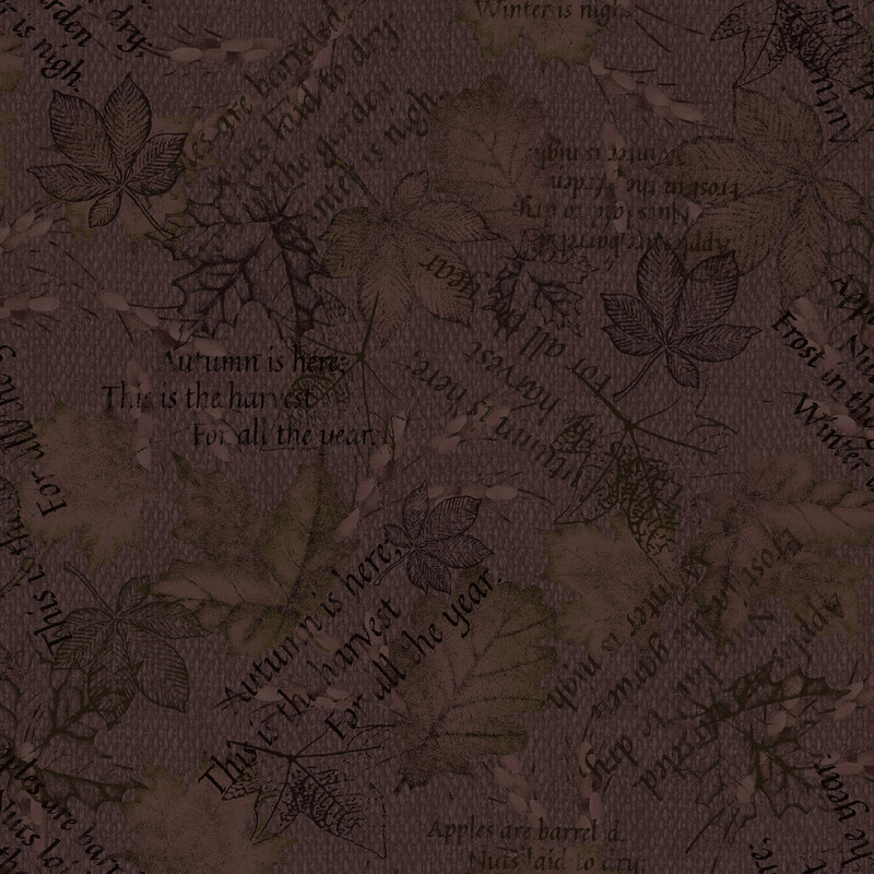 A carob brown woven textured fabric with printed leaves and autumn-themed text 