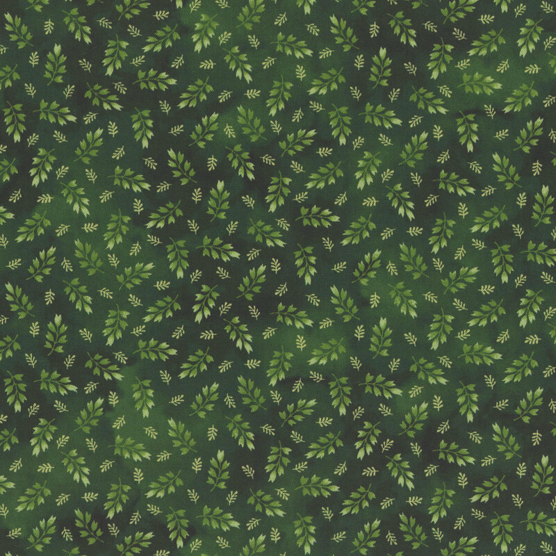 mottled hunter green fabric featuring a ditsy print of medium and light green leaves