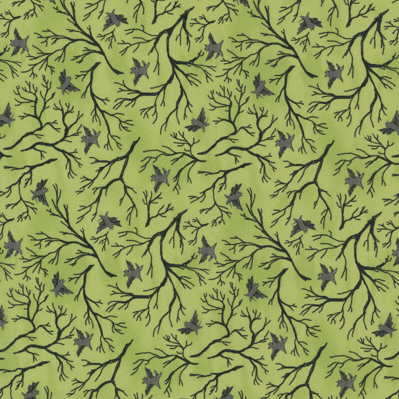 A mottled apple green fabric with black tree branches and bats