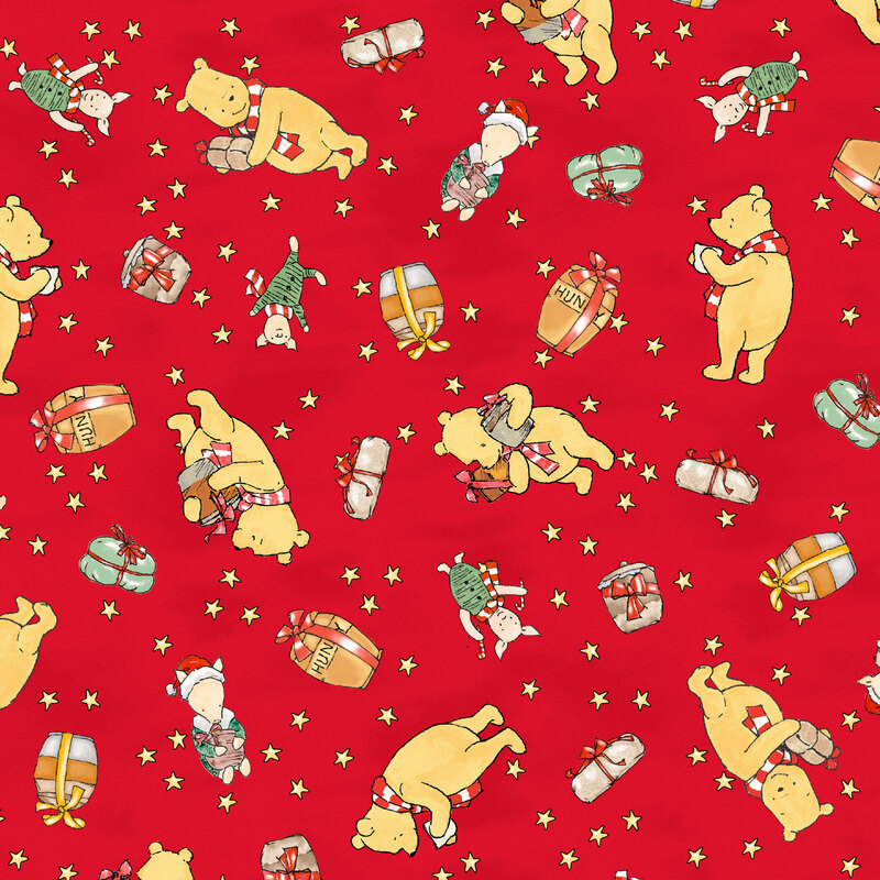 mottled bright red fabric featuring Winnie the Pooh and Piglet, presents, and jars of honey surrounded by stars.