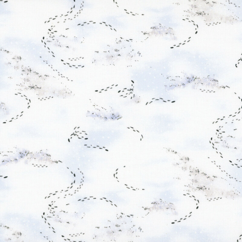 mottled white fabric with footprints tracked in the snow 