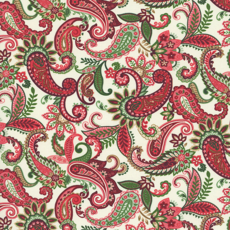 Off white fabric with a stylized paisley design with leaves and florals in green and red hues.