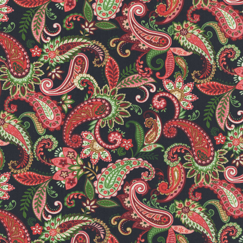 Black fabric with a stylized paisley design with leaves and florals in green and red hues.