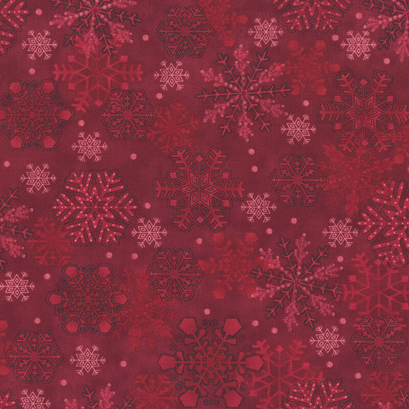 Tonal dark red fabric featuring ornamental snowflakes on a mottled background.