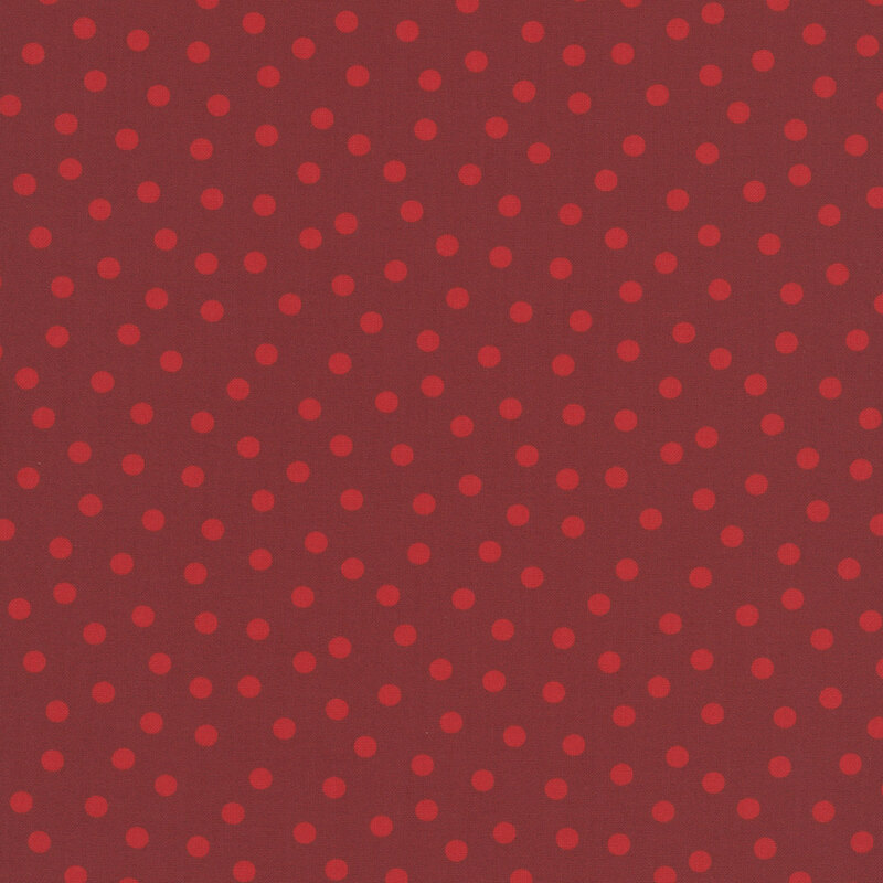 This dark red fabric with a pattern of tonal polka dots.