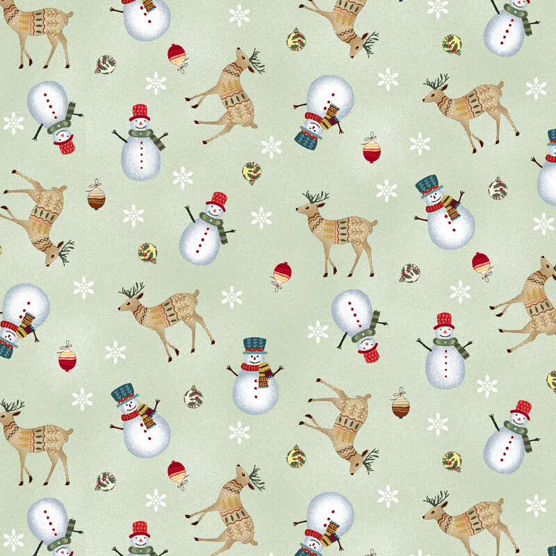 Pastel green fabric with a stylized Christmas pattern of tossed snowmen, deer, ornaments, and snowflakes, all adorned with small, intricate designs.