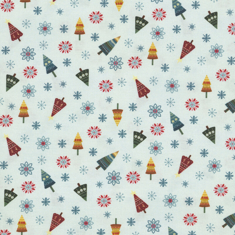 Pastel blue fabric with a playful pattern of colorful, stylized Christmas trees, snowflakes, and flowers in a tossed layout.