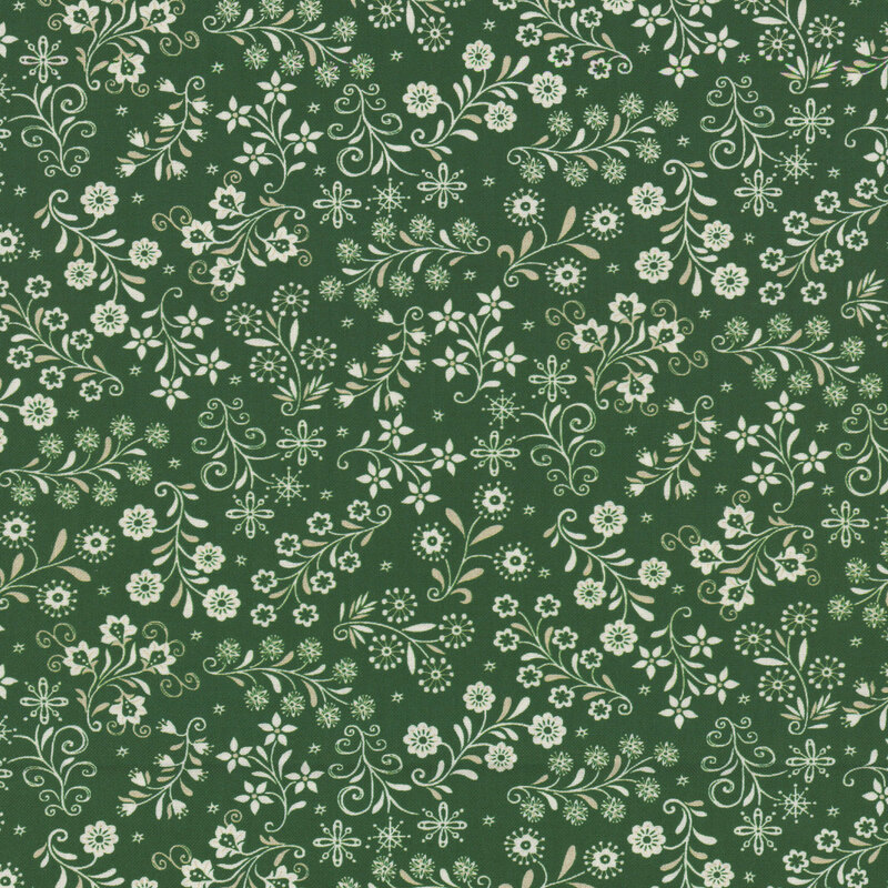 Green fabric with a stylized Scandinavian-themed design of white florals, snowflakes, and small stars.