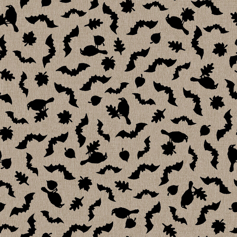 Jet black ravens, leaves, and bat silhouettes on textured warm gray fabric