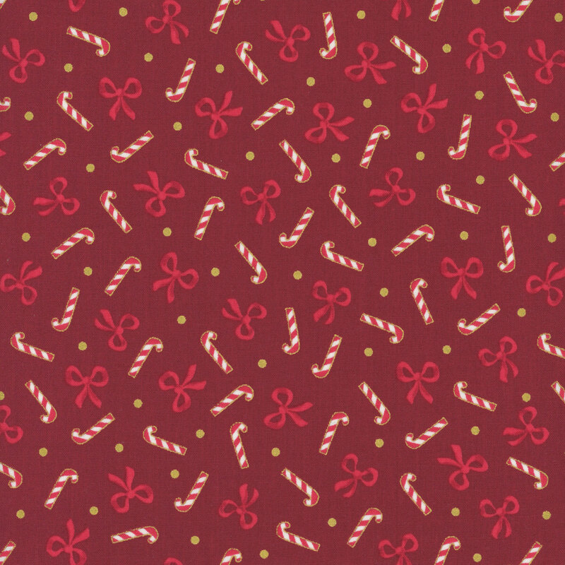 Crimson fabric with a tossed pattern of scarlet bows, candy canes, and gold dots