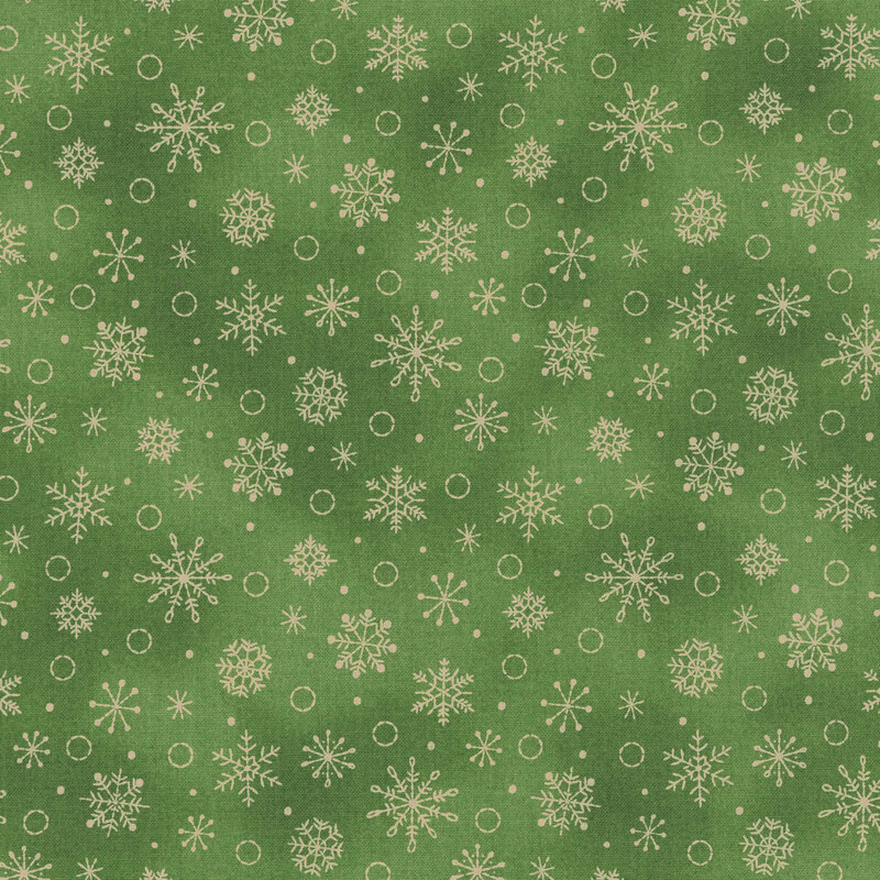 moss green mottled background with a pattern of beige snowflakes and circles